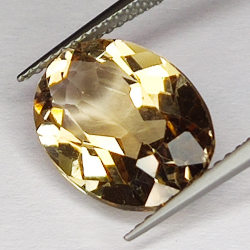 6.61ct Champagne Topaz taglio ovale 13.9x10.1mm