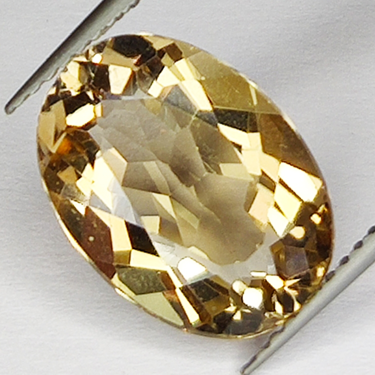 6.61ct Champagne Topaz taglio ovale 13.9x10.1mm