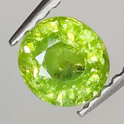 0.58ct Demantoid-Granat ovalerschliff 4.9x4.6mm