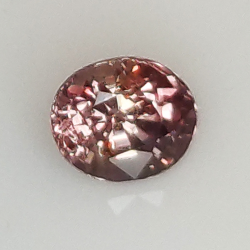 0.94ct Zaffiro Padparadscha taglio ovale 5.9x5.0mm