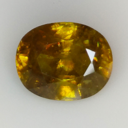 7.43ct Sphène Verte coupe ovale 12.9x10.1mm