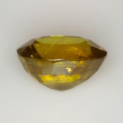 7.43ct Sfene verde taglio ovale 12.9x10.1mm