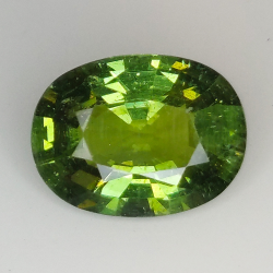 5.18ct Apatite verde taglio ovale 12.9x9.7mm