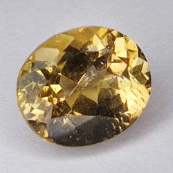 6.67ct Champagne Topaz taglio ovale 12.1x10.1mm