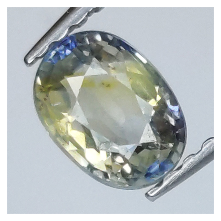 0,84 ct Saphir bleu et jaune taille ovale 5,82x4,28 mm