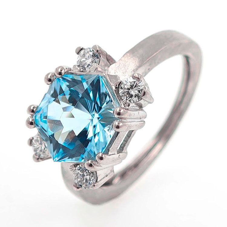 Gold design ring with special precision-cut blue topaz and diamonds