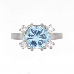 Gold design ring with special precision-cut blue topaz and diamonds