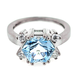 Gold design ring with special precision-cut blue topaz and diamonds