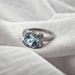 Gold design ring with special precision-cut blue topaz and diamonds