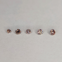 Fancy pink diamond in round cut 1.3-1.9 mm