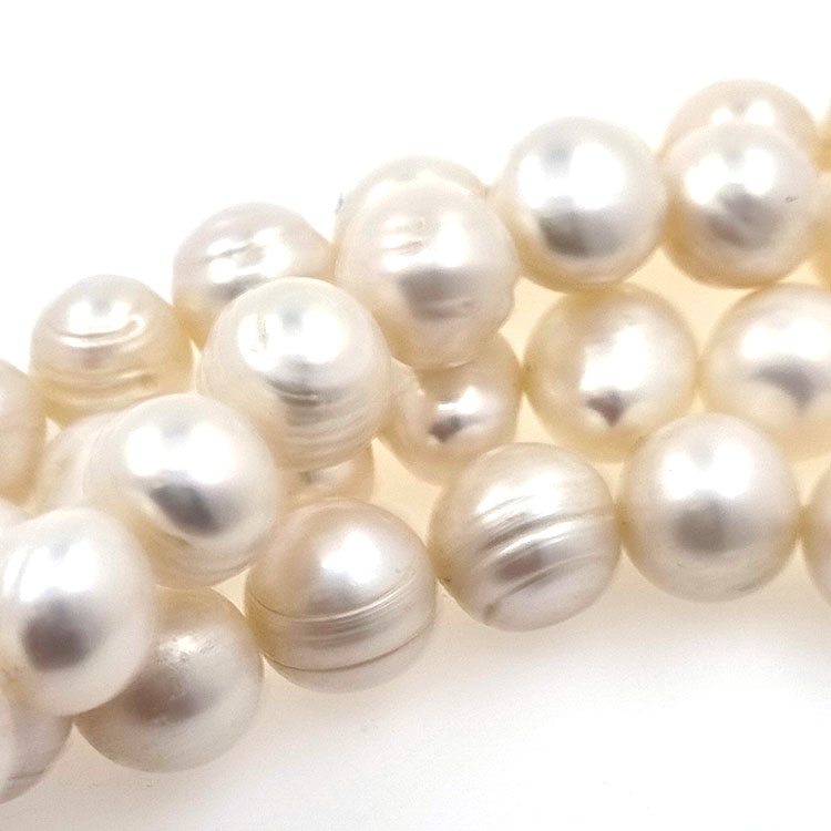 Strand of river pearls of 11,5 mm with 40 cm long